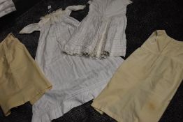 A small lot of early 20th century items,Two childrens wool petticoats or undergarments,a dress