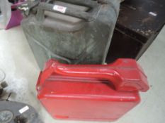 A 1952 dated War department petrol can and similar in red with integrated pouring spout.