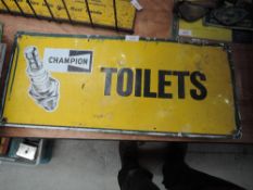 A Champion spark plugs adverting sign for Toilets.