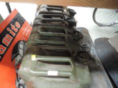 Four 20L petrol cans.