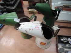 A selection of three garage oil jugs