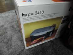 A HP psc 2410 printer in box.
