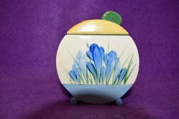 A Clarice cliff condiment or preserve jar with lid having crocus pattern in blue.