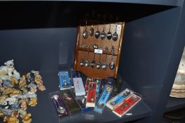 A selection of decorative spoons and rack