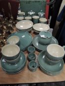 A selection of green Denby tableware, around 40 items in total.