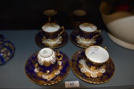 A set of six tea cup and saucer sets by Aynsley having deep blue and gold transfer design all pieces