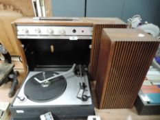 A vintage portable Ferguson record player with fold down deck and speaker.
