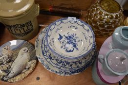 A selection of blue and white plastic bowls and plates,a boxed sugar and creamer, a stoneware lidded