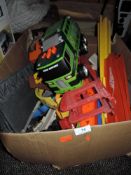A mixed box of childrens toys, including truck.