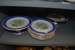 A selection of antique serving plates in hard paste having individual hand painted floral scenes