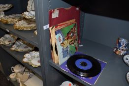 A selection of 45rpm vinyl singles including pop interest
