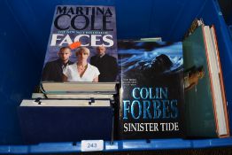 A selection of books and Chinese water colour set