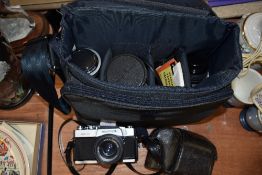 A Mamiya MXS 500 35mm SLR camera with Pentacon 50mm lens, Tamron Auto Zoom 85-205mm l3ns, Mamiya/