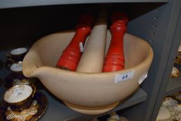 A large mortar and pestle stamped Meritor