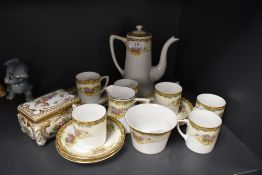 A Noritake part coffee set comprising of six cups and saucers,sugar basin, creamer and coffee pot,