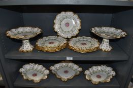 A part dinner service by Crescent china having scalloped design with hand painted and gilt