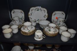 A part tea service by Plant Tuscan China having bright enamel decoration