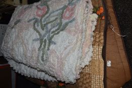 One retro sleeping bag and a candlewick bedspread