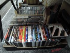 A large mixed lot of DVDs,CDs and two vintage books.
