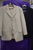 A gents pin striped wool suit jacket and a Rohan beige suit.