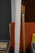 A large roll of photography studio paper and handles??