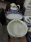 Three pieces of blue and white ware and a chamber pot with green floral pattern and gilt detailing.