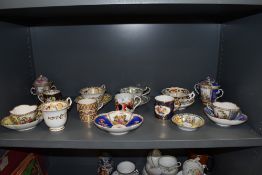 A fine selection of antique and later tea and coffee cups including Crown Derby Rockingham style and