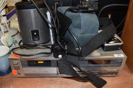 A selection of audio devices including Sonos speaker with booklet walkman and Technics tape deck al