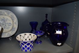 A selection of blue and white glass wares including cut cameo and Bristol blue water jug