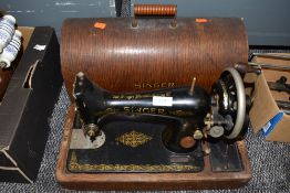 An early hand cranked Singer Sewing machine