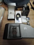 A selection of watches in boxes including Casio and a Togan mount cutter.