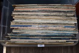A selection of vinyl records and albums including pop and rock interest