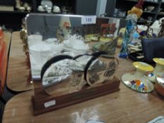 A set of limited edition Wainwright place mats and coasters in stand.57/1000.