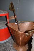 An antique copper coal bucket and sword style poker