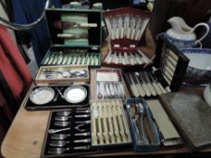 A collection of boxed vintage cutlery including cake forks, fish serving sets and more.