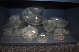 A collection of vintage pressed glass including dressing table sets, bowls and tazzas.