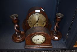Two art deco mantle clocks including rose wood style case and twist stem candle sticks