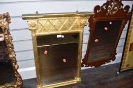 A column framed gilt mirror and oak framed with scroll work and carved phoenix decoration