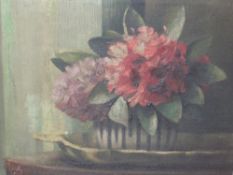An oil painting, Ila Adams, Flower study, signed and attributed verso, 30 x 39cm, framed and glazed
