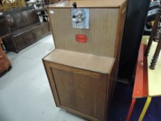 A vintage part oak cased home bar, labelled for Watneys