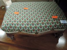 A Victorian footstool with later woolwork pad