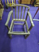 A traditional stained frame carver chair in need of recaning