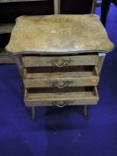 An early 20th Century continental style walnut three drawer side table, with ormolu effect