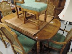 A modern hardwood extending dining table and eight (six plus two chairs) chair have fixed cushion