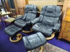 A pair of Stressless armchairs with footstools in dark leather with beech frames