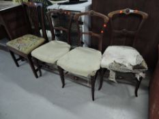 A set of three Victorian gothic style mahogany bedroom chairs