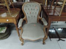 A Victorian bleached mahogany button back dining chair having knurl frame and later upholstery