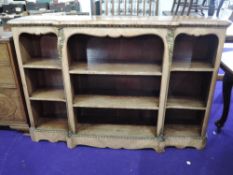 An early 20th Century continental style inlaid part walnut bookshelf, with ormolu effect