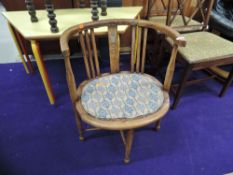 A late Victorian or Edwardian stained frame salon armchair, with repairs
