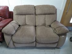 A two seater electric reclining sofa with good upholstery